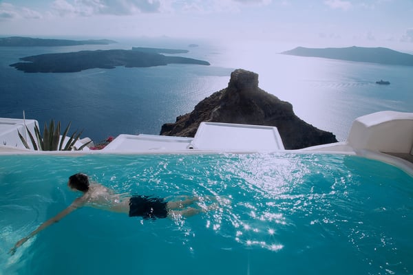 views of Santorini cliffs from a pool